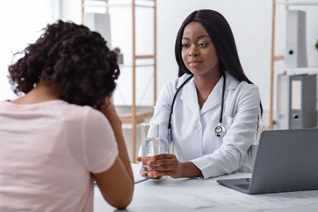 Female hormone specialist at True Phoenix offering support and guidance to a concerned patient.